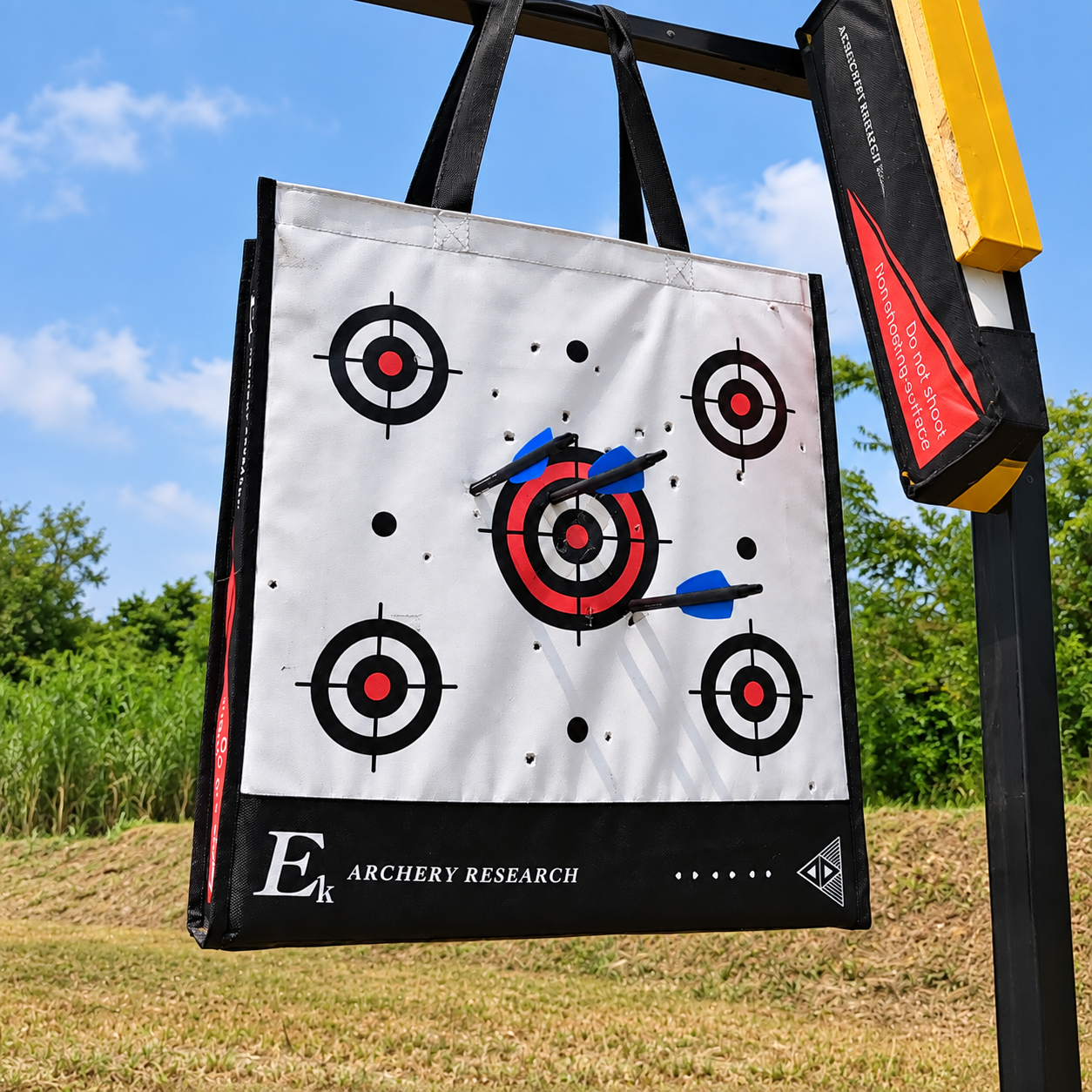Archery target with arrows grouped near the center after zeroing