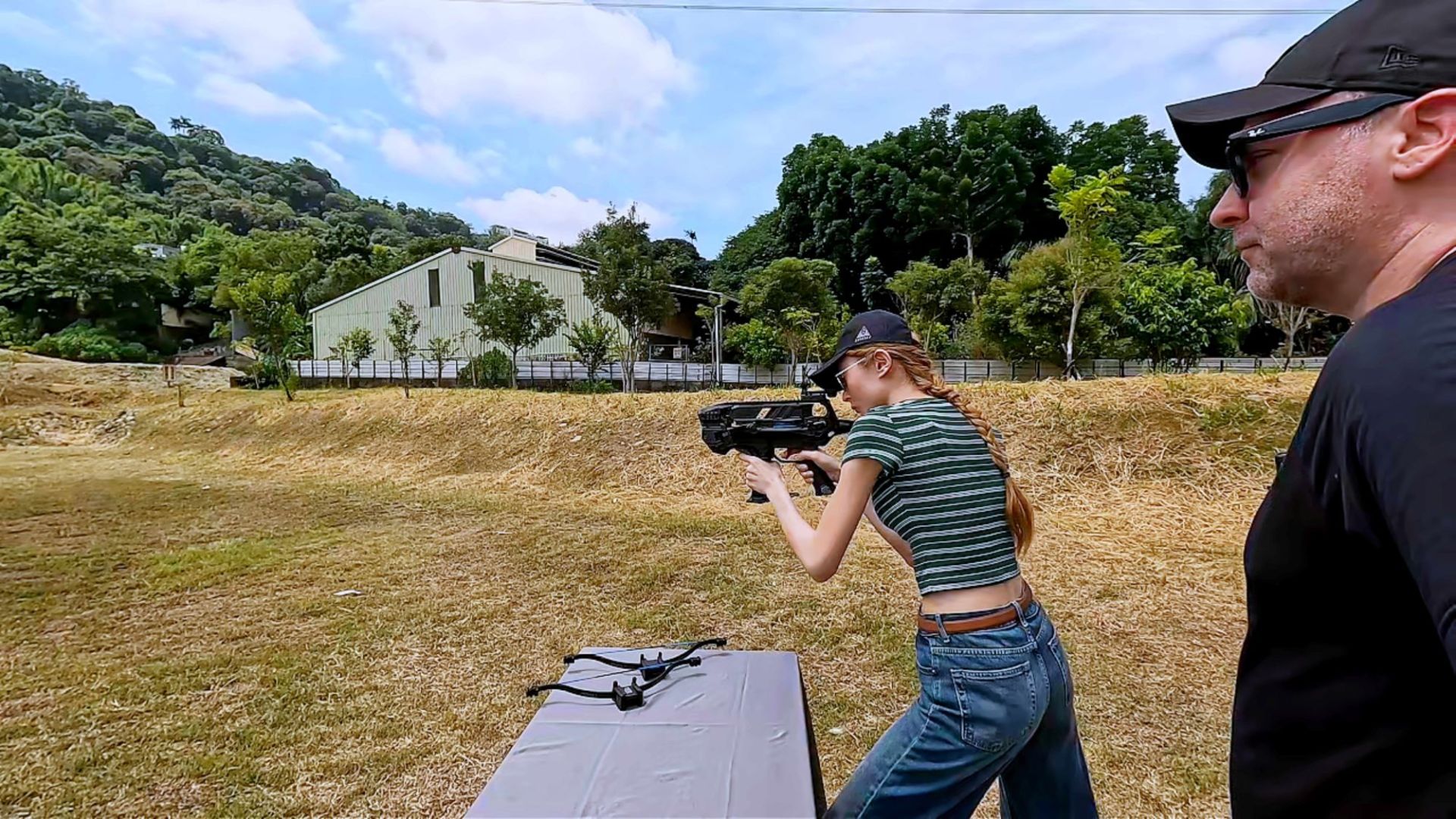 Beginner shooting a crossbow with red dot sight at the SPORT stage of the One-Minute Challenge
